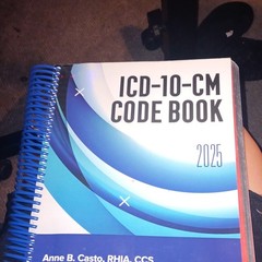 ICD-10-CM Code Book 2025 Textbook by Anne B. Casto, Spiral Bound, AHIMA Press